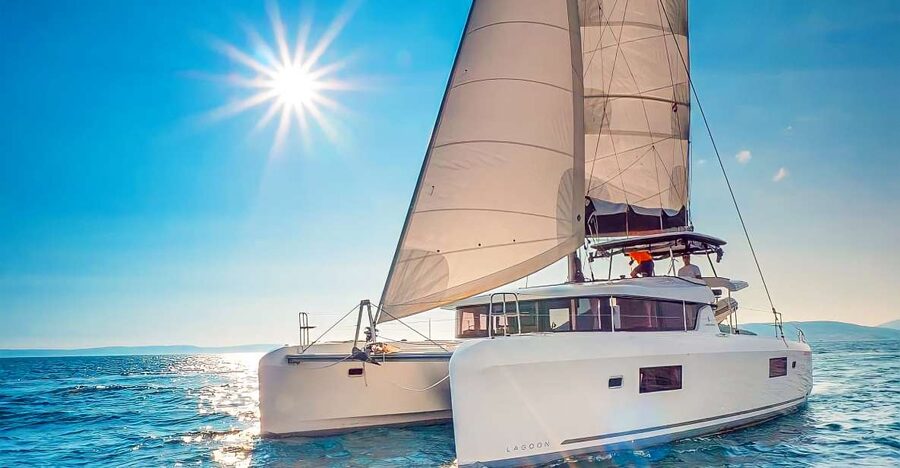 Funchal Bay: Dolphin & Whale Watch Luxury Catamaran Cruise - Swimming beneath the cliffs of Cabo Girão