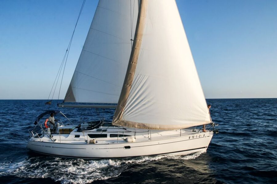 Tenerife: Sailboat Tour Whale Watching Food and Snorkeling - Sailing south from Puerto Colón