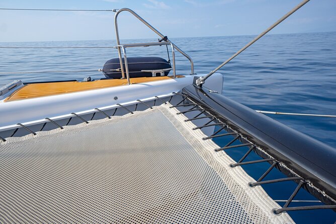 Tenerife Whales and Dolphins Watching Experience in Catamaran - Sandwiches, beer, and a relaxed meal at sea
